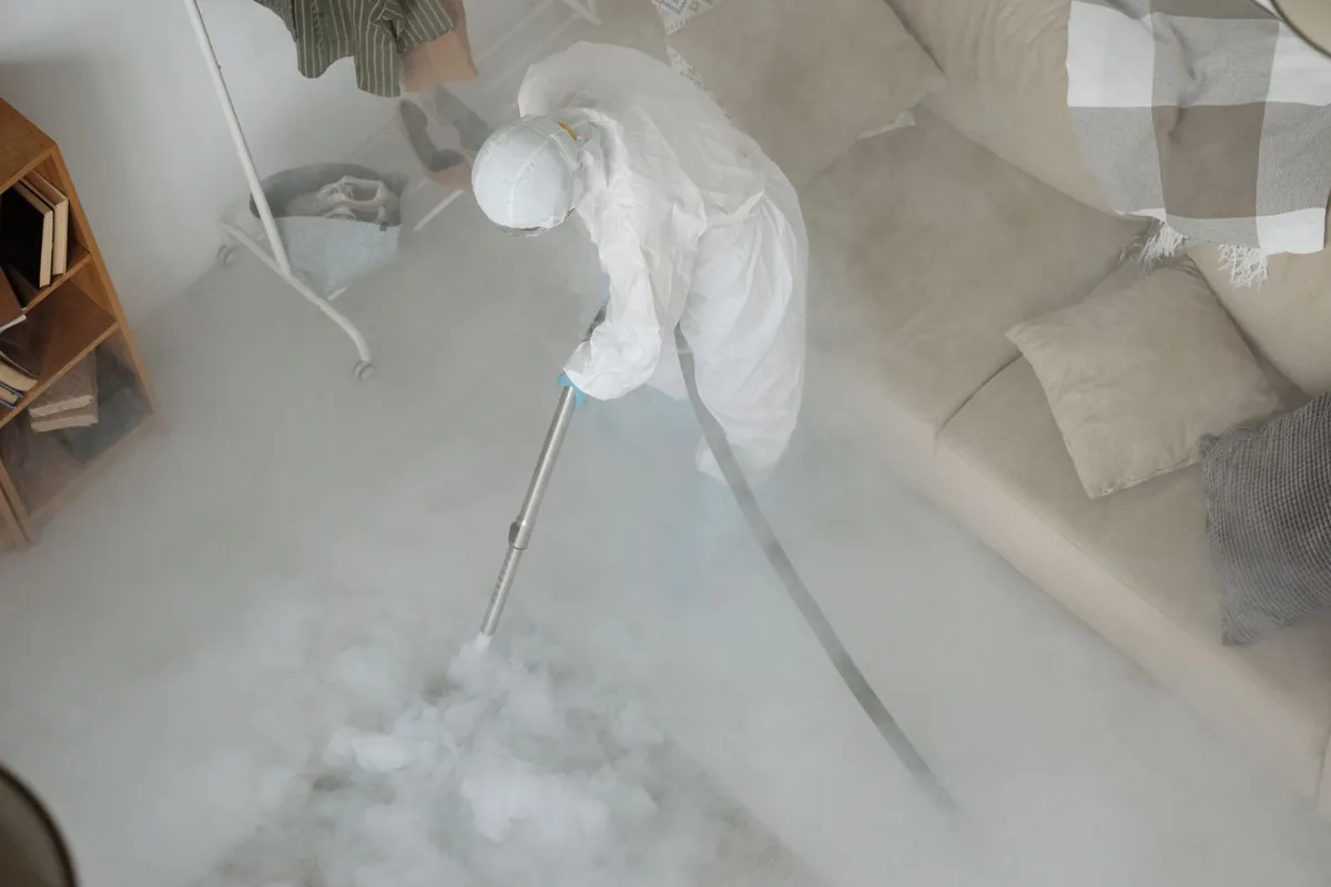 Biohazard cleanup technician in protective equipment, Morton, PA